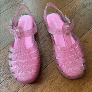Gently used pink glitter Melissa possesion jellies for girls. Size 2.
